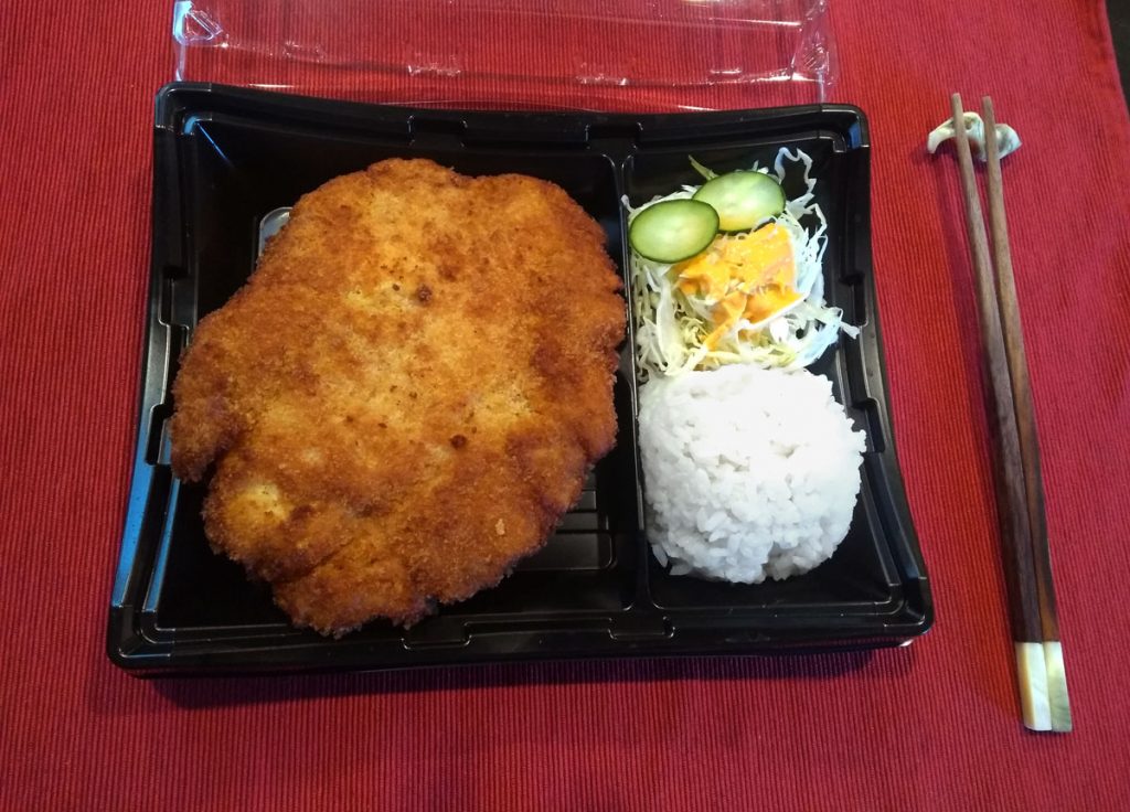 Dish of Chicken cutlet called Katsu served with kimbap.